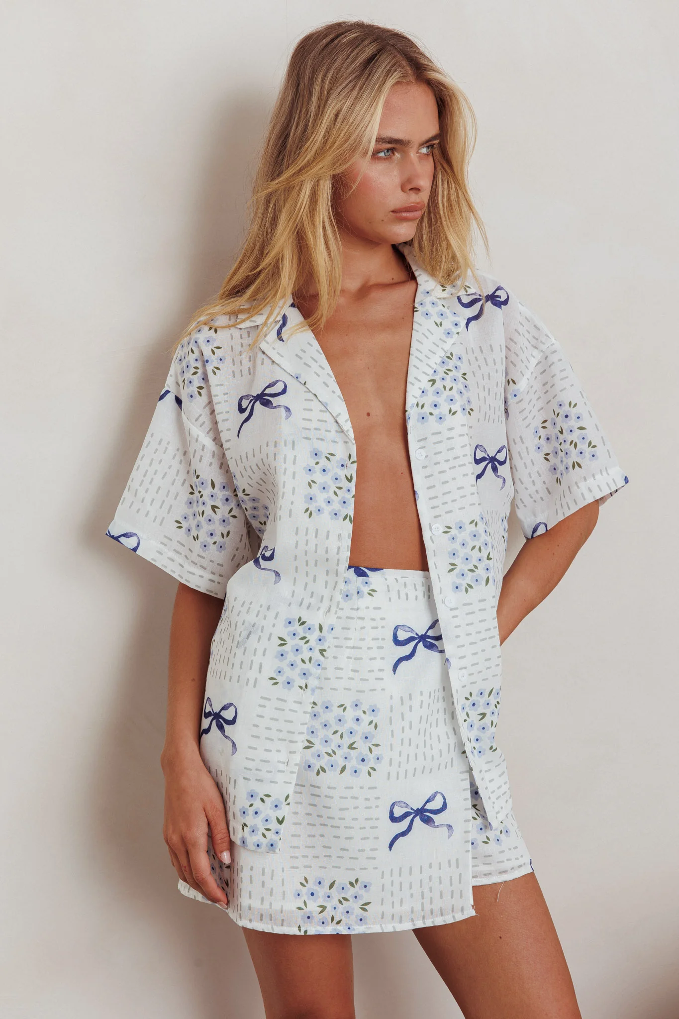 Ithaca Wrap Mini Skirt Bow Print Blue - Seraphlike